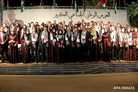 Palestinian President Mahmoud Abbas attends the national mass wedding ceremony, in the West Bank city of Jericho, April 20, 2015. Nearly 462 Palestinian couples were married in a ceremony organised by Palestinian preside...