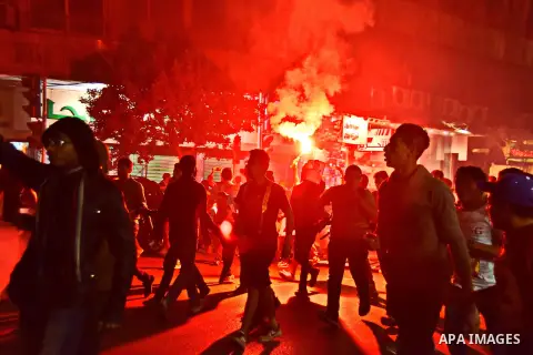 Members of Ultras Nahdawy groupe, who are supporters of the Muslim Brotherhood and ousted President Mohamed Morsi, light flares and shout slogans during a demonstration against the military and interior ministry at Tahri...