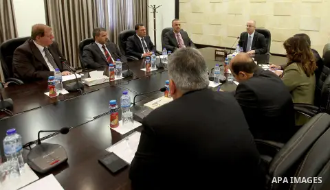 A handout picture released by Prime Minister Office shows Palestinian Prime Minister Rami Hamdallah, chairs a meeting, in the West Bank city of Ramallah on April 26, 2015. Photo by Prime Minister Office.