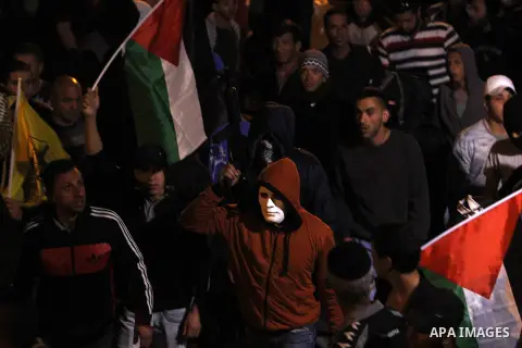 Palestinians carry the body of Ali Abu Ghannam during his funeral in the East Jerusalem neighbourhood of Al-tur early April 27, 2015. Israeli security forces killed Abu Ghannam on Saturday as he tried to attack them with...