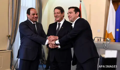 President of the Republic of Cyprus, Nikos Anastasiades (C), Egyptian President Abdel Fattah al-Sisi (L) and Greek Prime Minister Alexis Tsipras (R) shake hands after the press conference in Nicosia, Cyprus, 29 April 201...