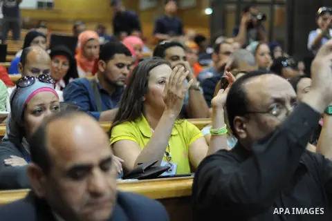 Supporters of Egypt's former president Hosni Mubarak, cry after his verdict hearing in a retrial for embezzlement on May 9, 2015 in the capital Cairo. The Egyptian court sentenced Mubarak and his two sons to three years...