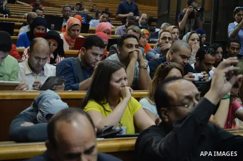 Supporters of Egypt's former president Hosni Mubarak, cry after his verdict hearing in a retrial for embezzlement on May 9, 2015 in the capital Cairo. The Egyptian court sentenced Mubarak and his two sons to three years...