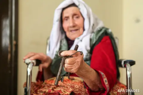 Palestinian refugee Kamela Safi, 90, holds the keys of her former house in the village of Biet Nabal as she sits at her home in the West Bank refugee camp of Jalazon, north of Ramallah om May 12, 2015. ''Nakba'' means in...