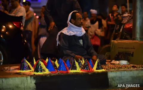 Egyptians celebrate the birthday of Sayida Zeinab, the granddaughter of Prophet Mohammad, near her shrine in Cairo, May 12, 2015. Photo by Amr Sayed