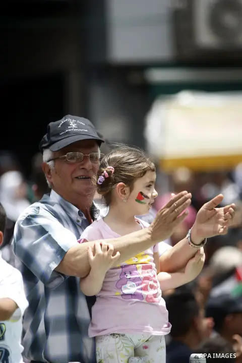 Palestinians take part in a march ahead of the commemorations of the 67th anniversary of the ''Nakba'', in the West Bank city of Ramallah on May 13, 2015. ''Nakba'' means in Arabic ''catastrophe'' in reference to the bir...