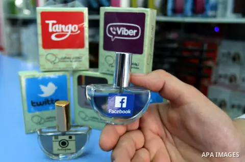 A Palestinian man displays perfumes in social media marks , at his shop in Khan Younis in the southern Gaza Strip, May 13, 2015. In a report on Internet freedom included 20 Arab countries, Palestine and Tunisia relativel...