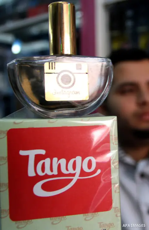 A Palestinian man displays perfumes in social media marks , at his shop in Khan Younis in the southern Gaza Strip, May 13, 2015. In a report on Internet freedom included 20 Arab countries, Palestine and Tunisia relativel...