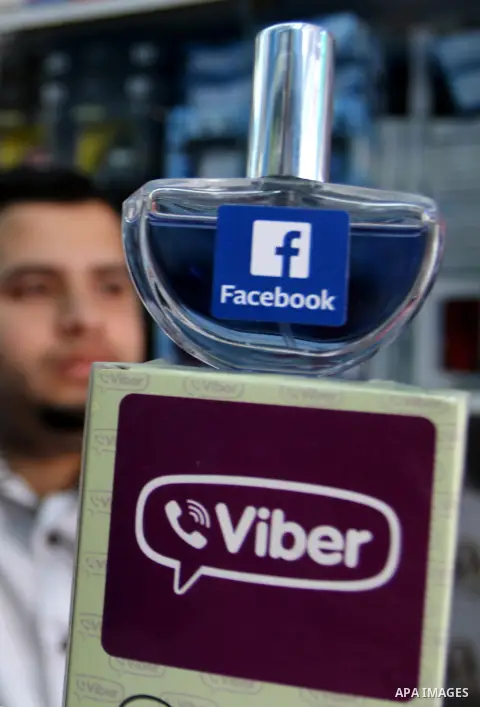 A Palestinian man displays perfumes in social media marks , at his shop in Khan Younis in the southern Gaza Strip, May 13, 2015. In a report on Internet freedom included 20 Arab countries, Palestine and Tunisia relativel...