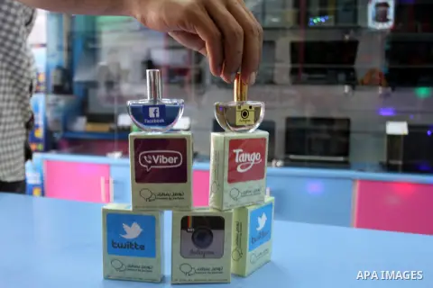 A Palestinian man displays perfumes in social media marks , at his shop in Khan Younis in the southern Gaza Strip, May 13, 2015. In a report on Internet freedom included 20 Arab countries, Palestine and Tunisia relativel...