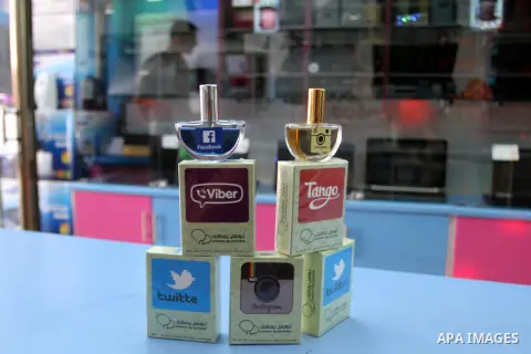 A Palestinian man displays perfumes in social media marks , at his shop in Khan Younis in the southern Gaza Strip, May 13, 2015. In a report on Internet freedom included 20 Arab countries, Palestine and Tunisia relativel...