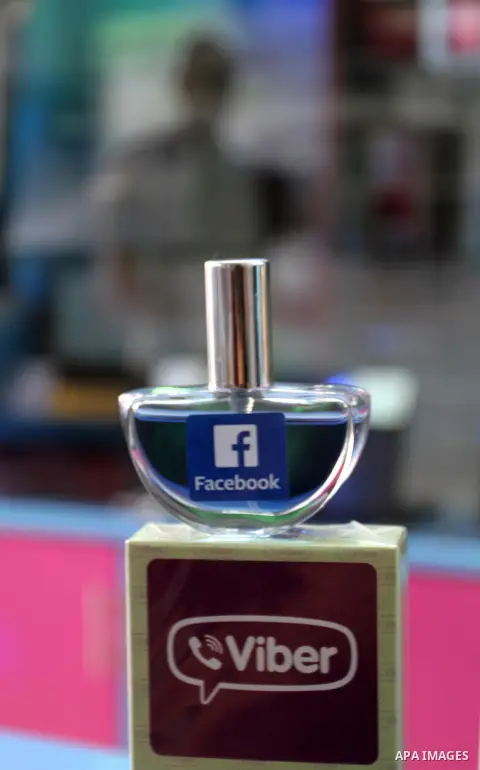 A Palestinian man displays perfumes in social media marks , at his shop in Khan Younis in the southern Gaza Strip, May 13, 2015. In a report on Internet freedom included 20 Arab countries, Palestine and Tunisia relativel...