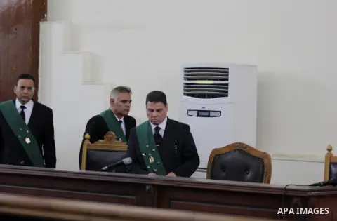 Judges attend the trial of Egyptian radical Islamist Mohammed al-Zawahiri, the brother of Al-Qaeda chief Ayman al-Zawahiri, at a court in Cairo on May 17, 2015. Photo by Amr Sayed