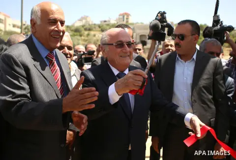 FIFA chief Sepp Blatte opens the playground during his visit to Dura al-Qar' village in the West Bank city of Ramallah May 20, 2015. Blatter, visiting the Middle East to try to persuade the Palestine FA (PFA) to drop a p...