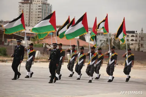 Palestinian security forces show their skills during a military training graduation ceremony in Gaza City on May 21, 2015. Photo by Ashraf Amra