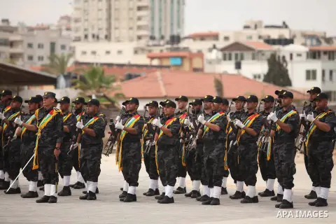 Palestinian security forces show their skills during a military training graduation ceremony in Gaza City on May 21, 2015. Photo by Ashraf Amra