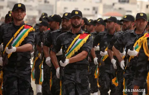 Palestinian security forces show their skills during a military training graduation ceremony in Gaza City on May 21, 2015. Photo by Ashraf Amra