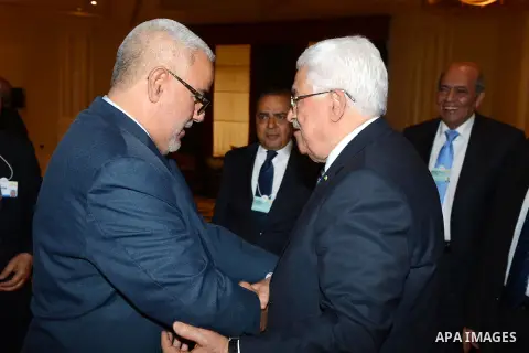 Palestinian President Mahmoud Abbas meets with Moroccan Prime Minister Abdelilah Benkirane at the opening day of the World Economic Forum (WEF) on the Middle East and North Africa, in the Dead Sea resort of Shuneh, west...
