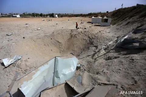 A Palestinian man looks the damage after an Israeli airstrike in Beit Lahiya in the northern Gaza Strip May 27, 2015. Israeli aircraft struck a number of sites in the Gaza Strip from the air early on Wednesday, residents...