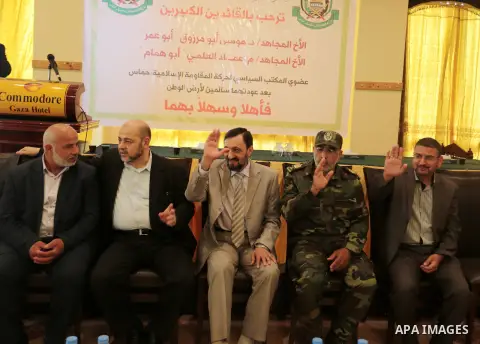 Palestinian Hamas leaders Mousa Abu Marzouk and Imad al-Alami, attend a welcome reception in Gaza city on May 28, 2015. Photo by Ramadan Al-Agha