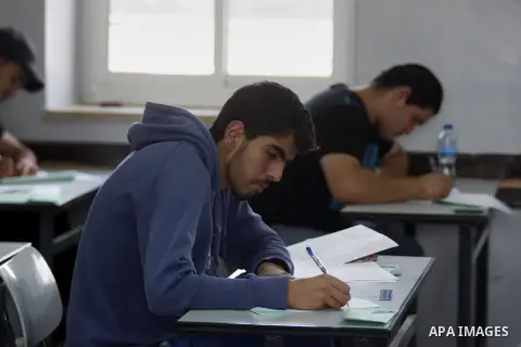 Palestinian male students sit for their final high school exams, known as "Tawjihi", in the West Bank city of Ramallah, on May 30, 2015. Nearly 81,000 Palestinian students sat for the first session of their high school e...