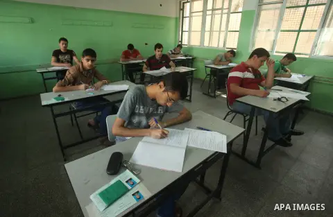 Palestinian male students sit for their final high school exams, known as "Tawjihi", in Gaza city on May 30, 2015. Nearly 81,000 Palestinian students sat for the first session of their high school exams seeking to obtain...