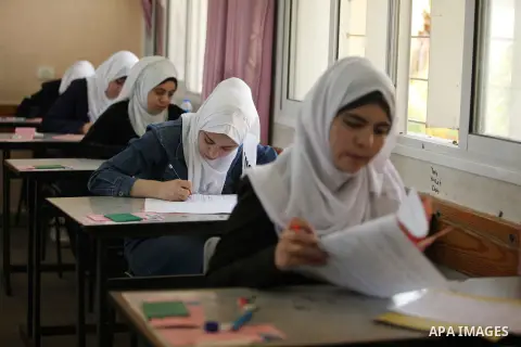 Palestinian female students sit for their final high school exams, known as "Tawjihi", in Gaza city on May 30, 2015. Nearly 81,000 Palestinian students sat for the first session of their high school exams seeking to obta...