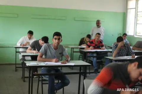 Palestinian male students sit for their final high school exams, known as "Tawjihi", in Gaza city on May 30, 2015. Nearly 81,000 Palestinian students sat for the first session of their high school exams seeking to obtain...