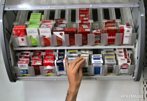 A Palestinian vendor sells cigarettes in the southern Gaza Strip City of Rafah, on May 31, 2015. Smuggling through tunnels began several months after Islamic Hamas movement's control of the Gaza Strip and the Israeli blo...