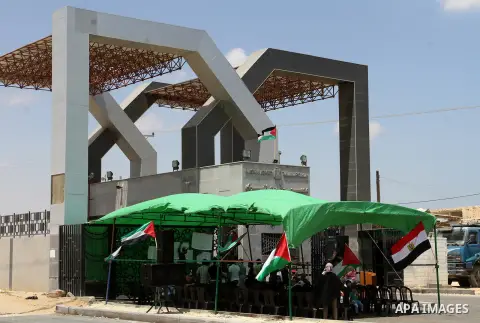 Palestinians take part in a protest demanding opening Rafah crossing border between Egypt and Gaza Strip, in Rafah in the southern Gaza Strip on June 2, 2015. Egyptian authorities opened the Rafah crossing last week for...