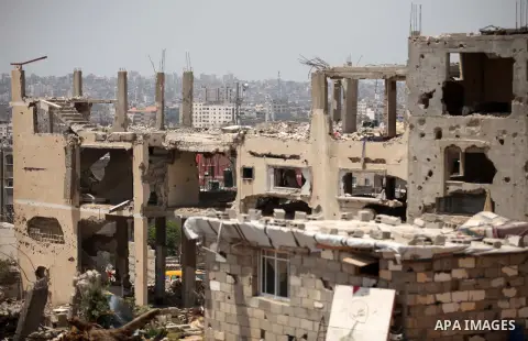 The rubbles of houses, which were destroyed during the 50-day war between Israel and Hamas militants in the summer of 2014, in the Al-Shaaf neighbourhood, on June 06, 2015. Qatar's ambassador Mohammed al-Emadi announced...