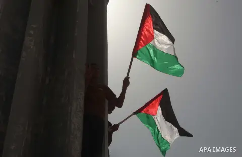 Palestinians take part in a protest demanding for the opening of a waterway, reconstruction of houses, and to break the siege at the Gaza seaport on March 07, 2015. Photo by Ashraf Amra