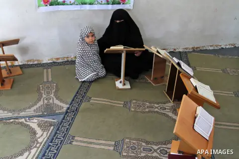 Palestinian girls attend a Quran lesson at a Hamas-sponsored summer program, during summer vacation at a mosque in Rafah, southern Gaza Strip, on June 7, 2015. The Quran memorisation program is one of the latest activiti...