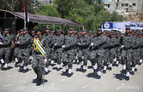 Members of Palestinian national security forces march during a military graduation ceremony in the northern Gaza Strip, June 11, 2015. Photo by Ashraf Amra