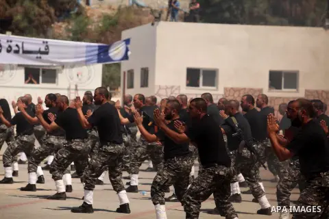 Members of Palestinian national security forces demonstrate their skills during a military graduation ceremony in the northern Gaza Strip, June 11, 2015. Photo by Ashraf Amra