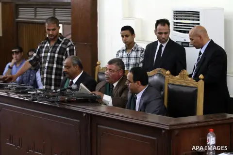 The Judge displays the weapons used by Ansar Bait Al-Maqdis group, during their trial in Cairo on June 11, 2015. Cairo criminal court Thursday adjourned the trial of 213 suspects of Ansar Bait Al-Maqdis group, on charges...