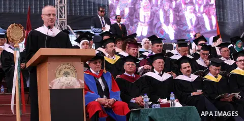 Palestinian Prime Minister Rami Hamdallah gives a speech during students graduation ceremony at the Birzeit University near the West Bank city of Ramallah, June 12, 2015. Photo by Prime Minister Office