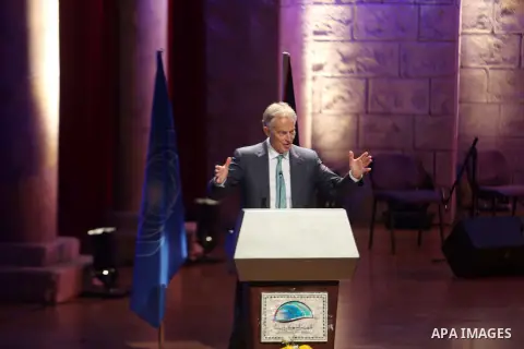 Former British Prime Minister Tony Blair speaks during an International Conference on religious tourism in the West bank city of Bethlehem June 15, 2015. The conference was organized by the United Nations World Tourism O...