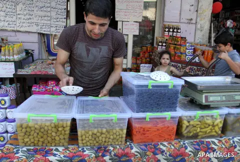 A Palestinian vendor displays pickles at a market in Rafah in the southern Gaza strip as the faithful prepare for the start of the Muslim holy fasting month of Ramadan on June 17, 2015. More than 1.5 billion Muslims arou...