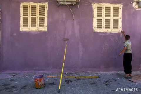 A photo taken on June 17, 2015 shows colored houses in the old city of Gaza, as Palestinians colored the walls of houses in the area to prepare for the start of the Muslim holy fasting month of Ramadan. More than 1.5 bil...