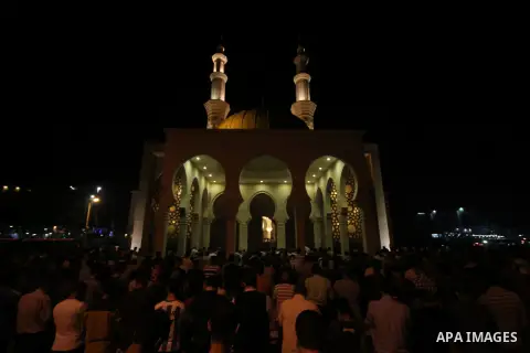 Palestinian worshipers perform take part in an evening prayer "Taraweeh", at El Khalidi mosque, in Gaza city, on June 17, 2015. Millions of Muslims around the world will mark the start of Ramadan on Thursday June 18, a m...