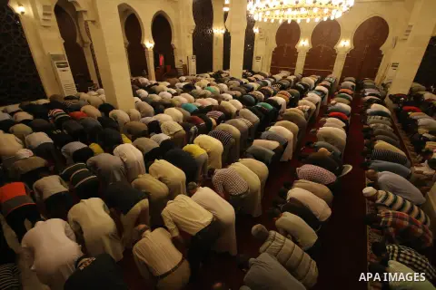 Palestinian worshipers perform take part in an evening prayer "Taraweeh", at El Khalidi mosque, in Gaza city, on June 17, 2015. Millions of Muslims around the world will mark the start of Ramadan on Thursday June 18, a m...