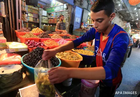 A Palestinian vendor displays pickles on the first day of the holy month of Ramadan in Gaza City June 18, 2015.as the faithful prepare to start fasting. More than 1.5 billion Muslims around the world will mark the month,...