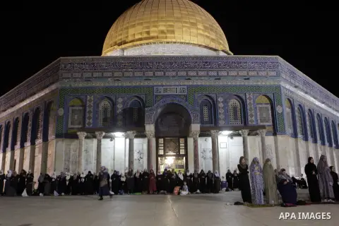 Palestinian Muslim worshipers perform 'taraweeh', nightly prayer of the month of Ramadan outside the al-Aqsa mosque in Jerusalem's old city on June 18, 2015. During Ramadan, Muslim believers abstain from eating, drinking...