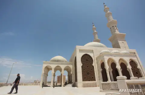 Palestinian man walk outside a mosque during the holy month of Ramadan in Gaza city on 20 June 2015. Muslims around the world are observing the holy fasting month of Ramadan in which they refrain from eating, drinking, s...