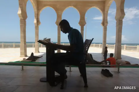 A Palestinian man reads the Koran in a mosque during the holy month of Ramadan in Gaza city on 20 June 2015. Muslims around the world are observing the holy fasting month of Ramadan in which they refrain from eating, dri...