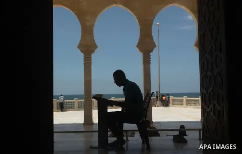 A Palestinian man reads the Koran in a mosque during the holy month of Ramadan in Gaza city on 20 June 2015. Muslims around the world are observing the holy fasting month of Ramadan in which they refrain from eating, dri...