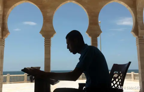 A Palestinian man reads the Koran in a mosque during the holy month of Ramadan in Gaza city on 20 June 2015. Muslims around the world are observing the holy fasting month of Ramadan in which they refrain from eating, dri...
