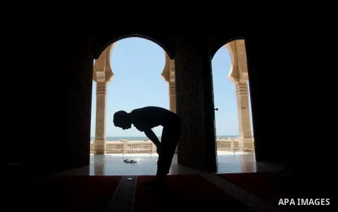 A Palestinian man prays in a mosque during the holy month of Ramadan in Gaza city on 20 June 2015. Muslims around the world are observing the holy fasting month of Ramadan in which they refrain from eating, drinking, sex...