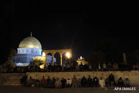 Palestinian Muslim worshipers perform 'taraweeh', nightly prayer of the month of Ramadan outside the al-Aqsa mosque in Jerusalem's old city on June 20, 2015. During Ramadan, Muslim believers abstain from eating, drinking...